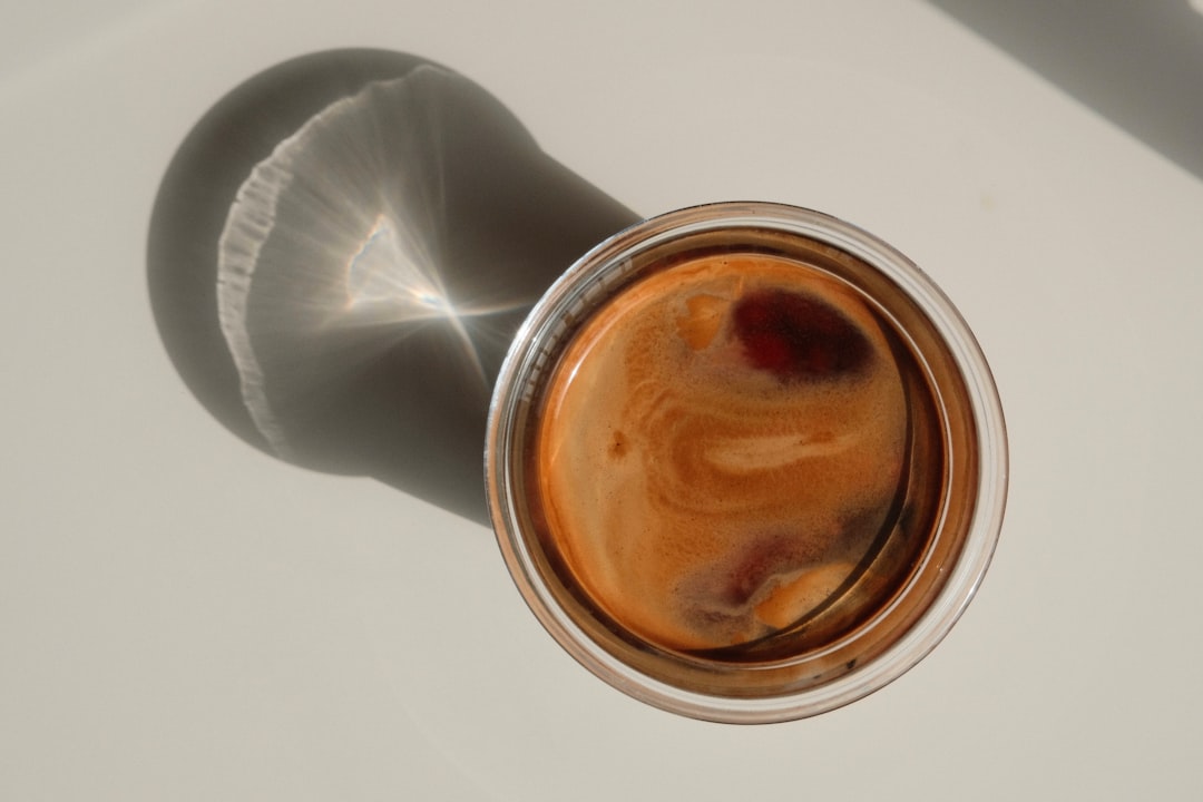 An extreme close-up of a sauce reducing with tiny bubbles, a knife cutting through a crispy crust, or cheese pulling dramatically